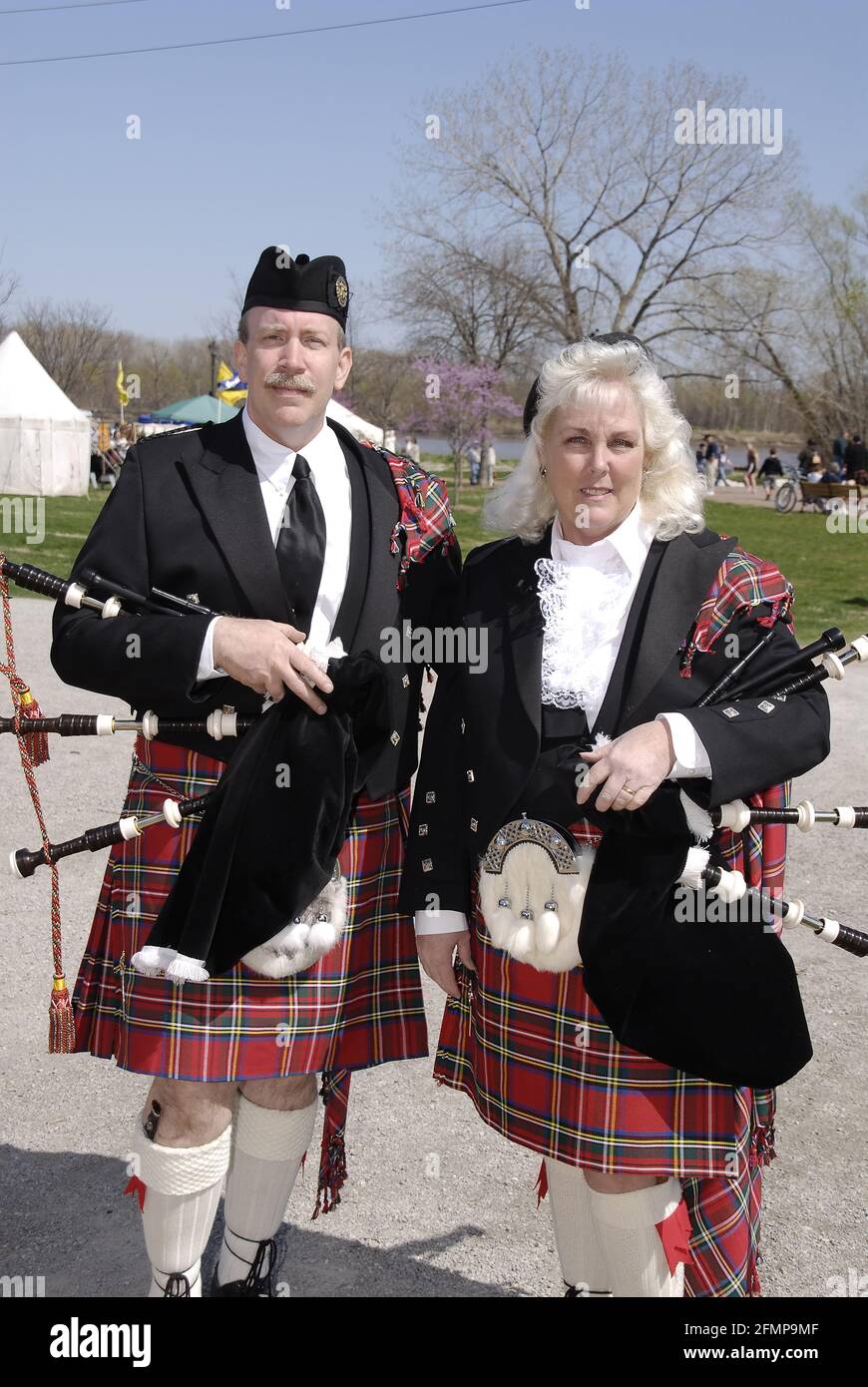 ST. CHARLES, UNITED STATES - Apr 05, 2009: A portrait of a couple of bagpipe players dressed in traditional Scottish attire at a Scottish heritage fes Stock Photo