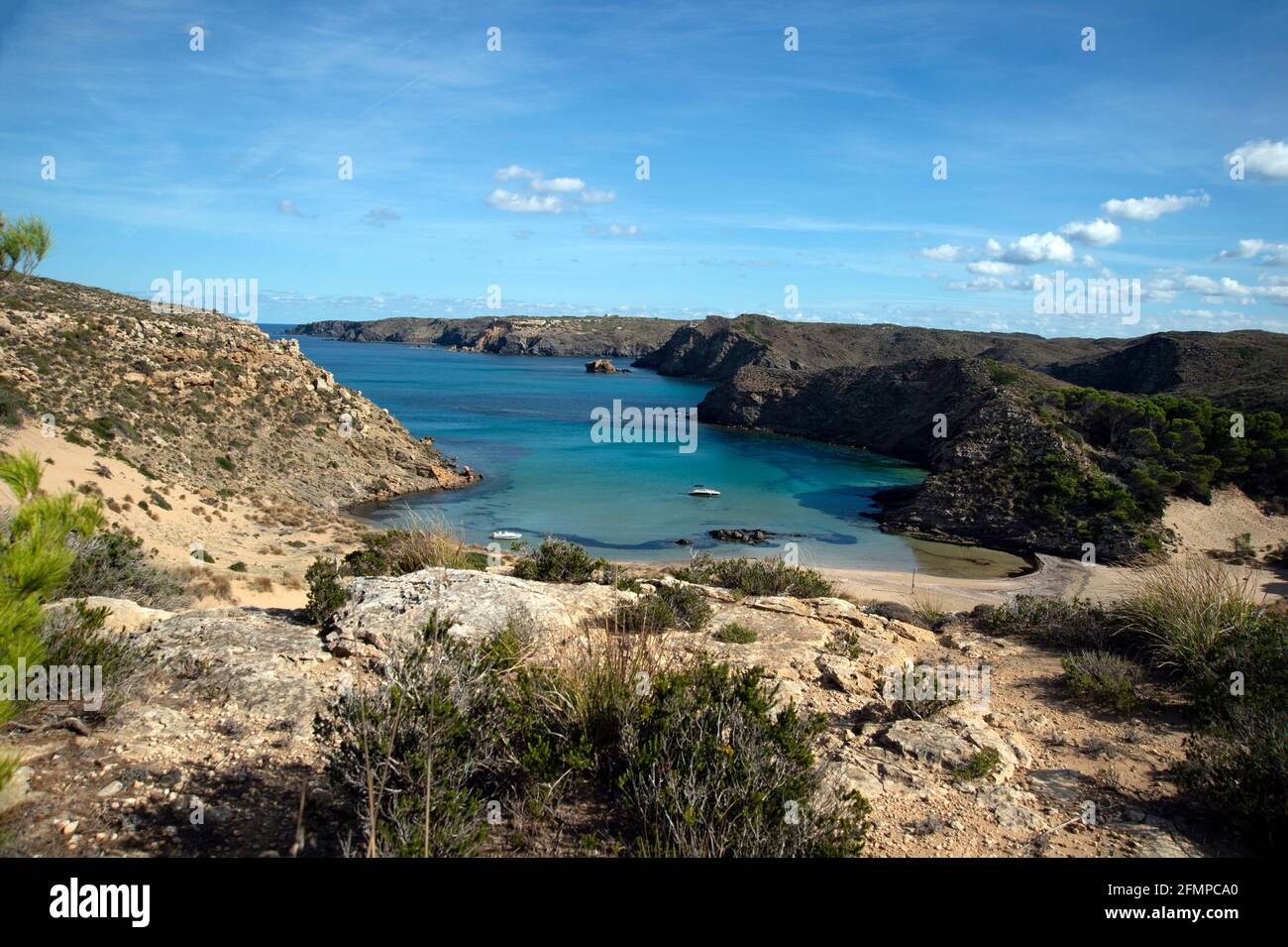 a small boat moored at mongofre beach on the north coast of menorca spain Stock Photo