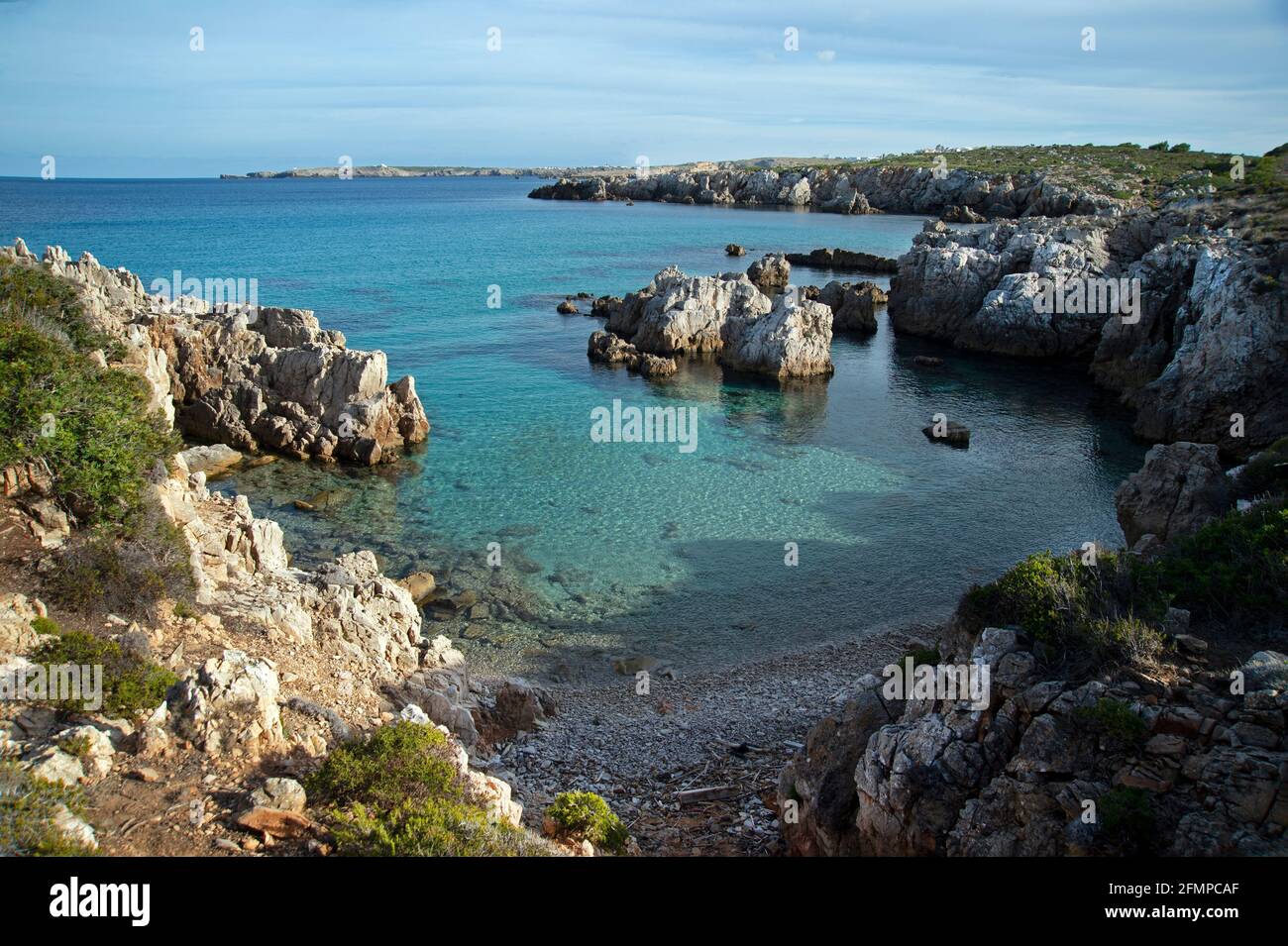 beautiful turquoise waters off the north rocky coast of menorca spain Stock Photo