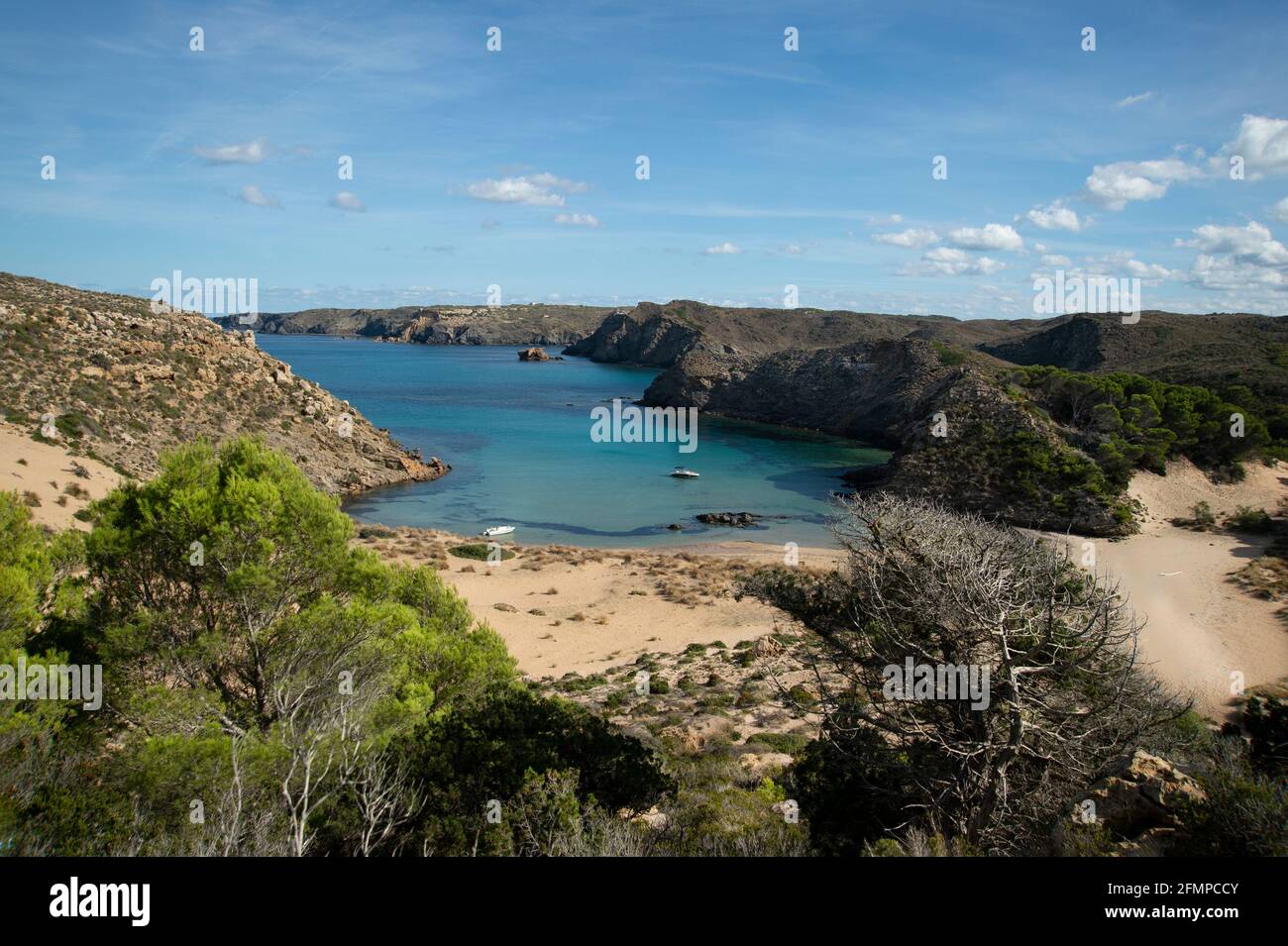 a small boat moored at mongofre beach on the north coast of menorca spain Stock Photo