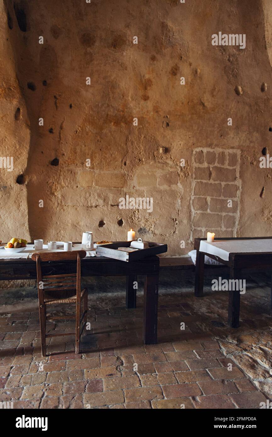 Dining rooms of the hotel Le Grotte della Civita, It is a hotel housed in ancient cave houses by the projects of 'Sextantio' ,  Matera, Basilicata, It Stock Photo