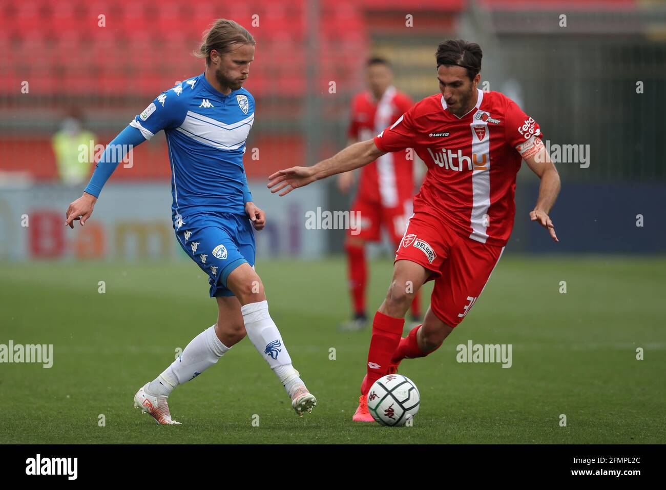 Monza, , 10th May 2021. Birkir Bjarnason of Brescia Calcio plays the ball as Mario Sampirisi of AC Monza closes in during the Serie B match at U-Power Stadium, Monza. Picture credit should read: Jonathan Moscrop / Sportimage Stock Photo