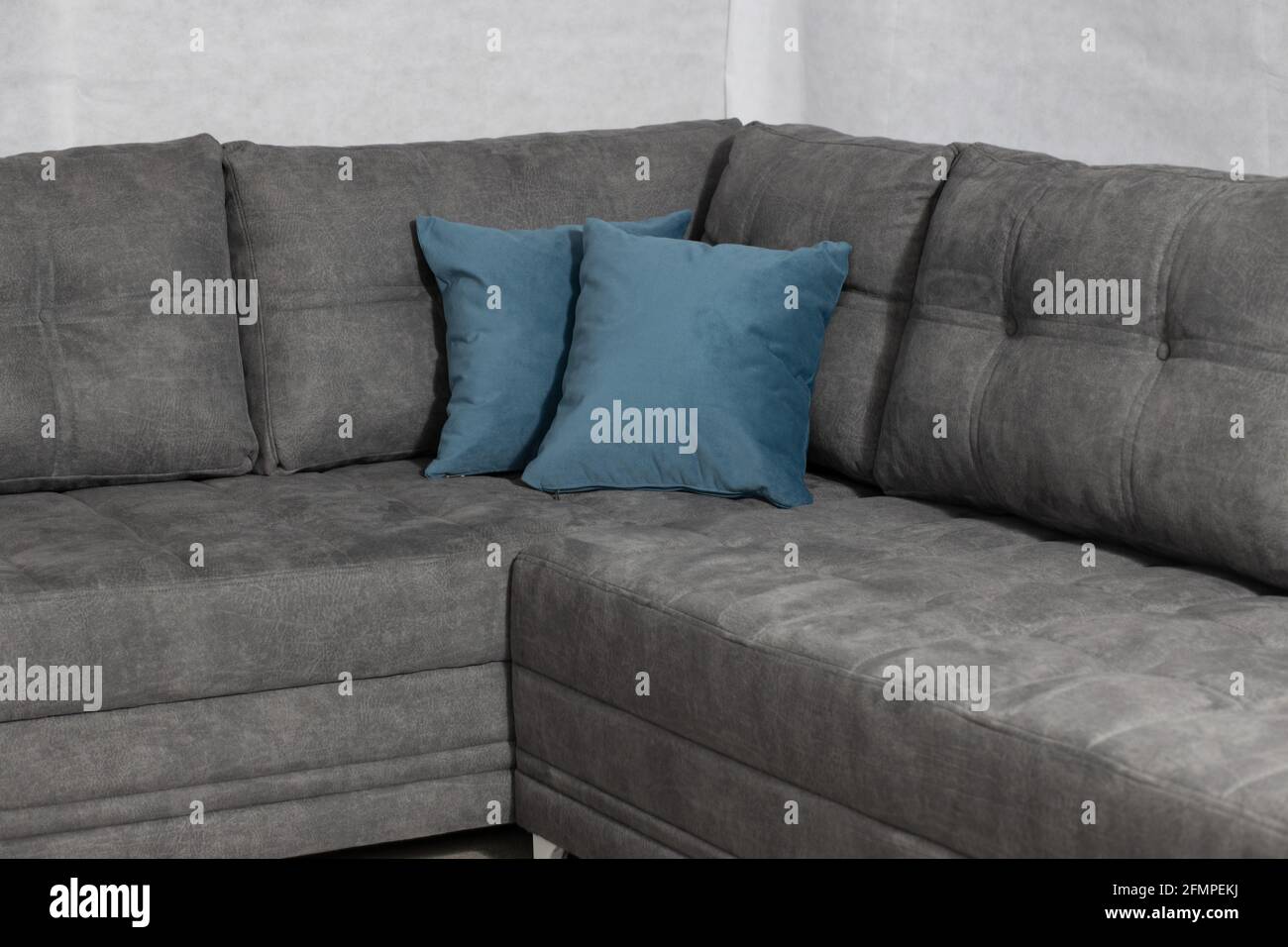 Grey corner sofa at home Stock Photo Alamy