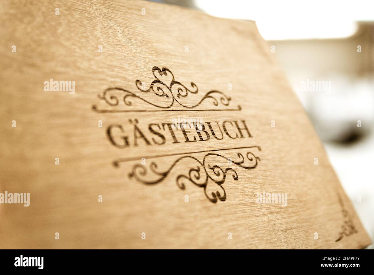 GERMANY, GERMANY - Aug 08, 2020: wooden book with the guestbook sign in a nice and beautiful layout Stock Photo
