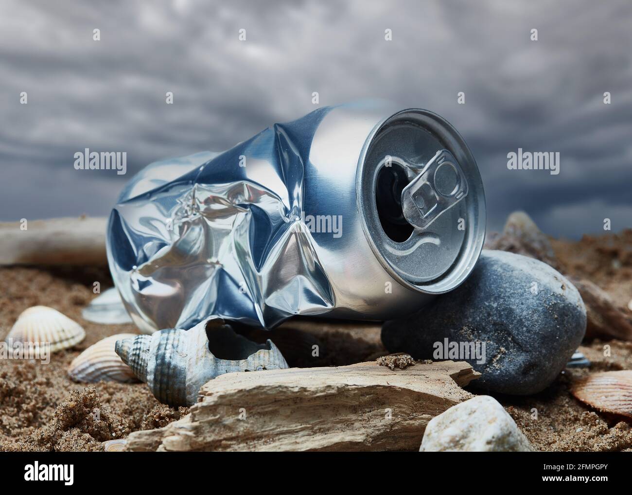 metal drinks can discarded on beach Stock Photo