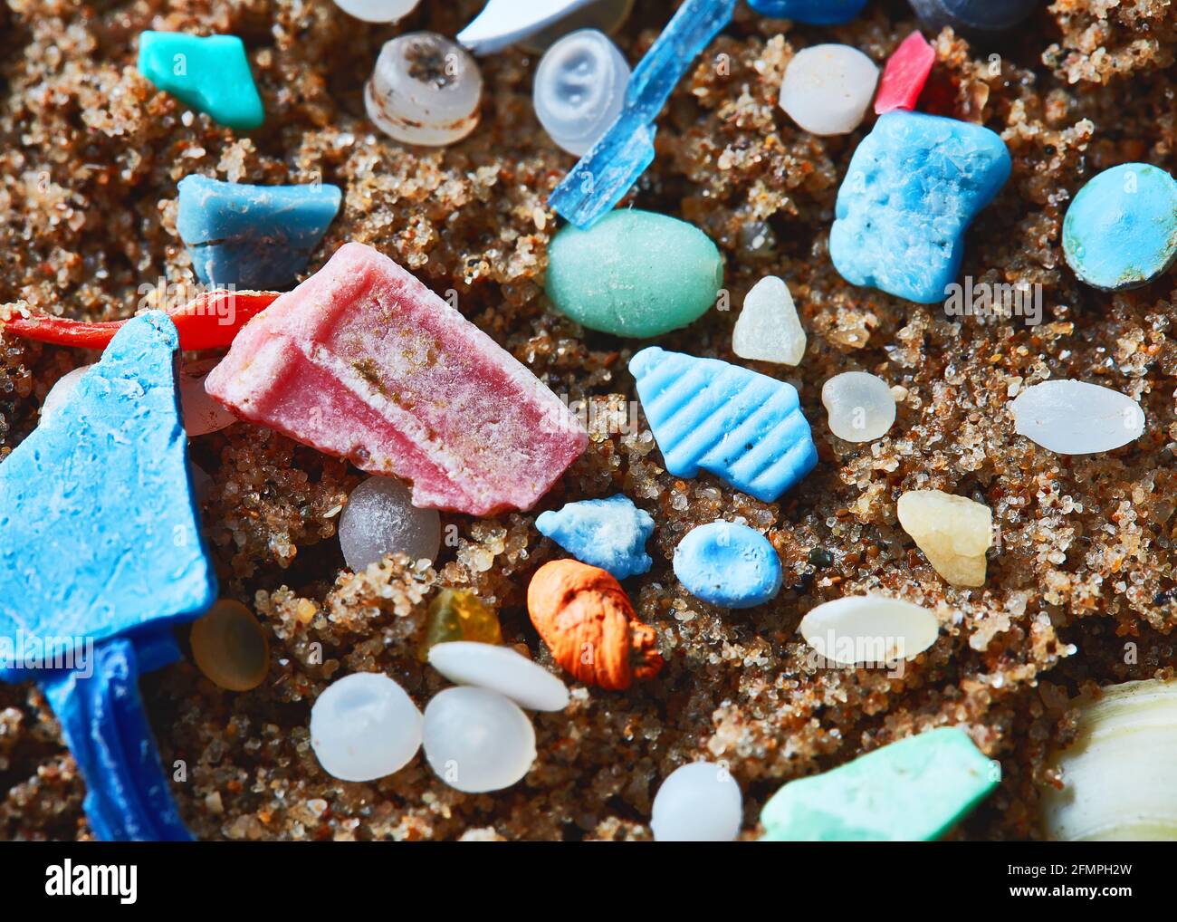 Macro image of ocean micro plastic on sand Stock Photo