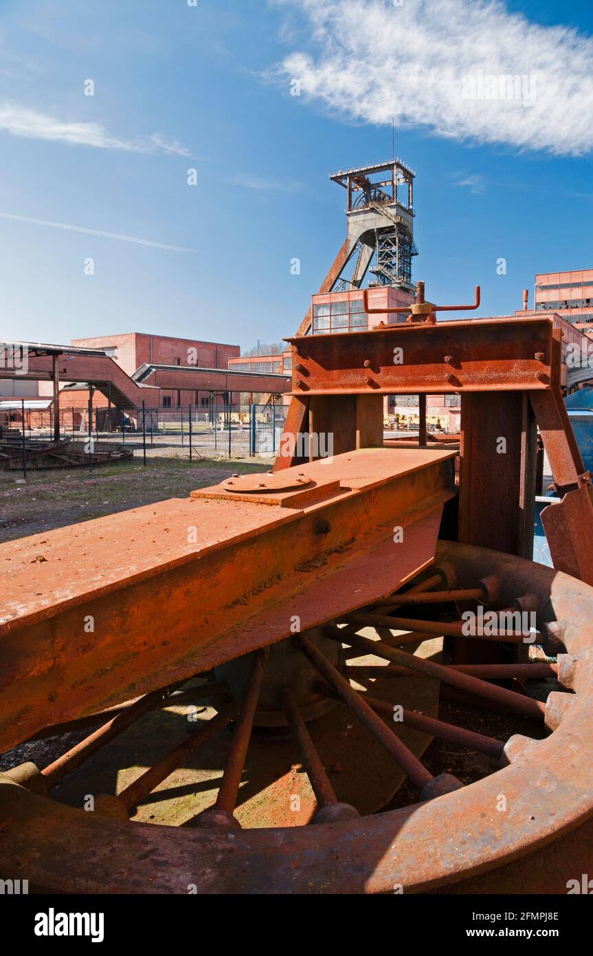 Old mine shaft tower with wheel in the foreground, La Mine Wendel museum, Moselle (57), France Stock Photo