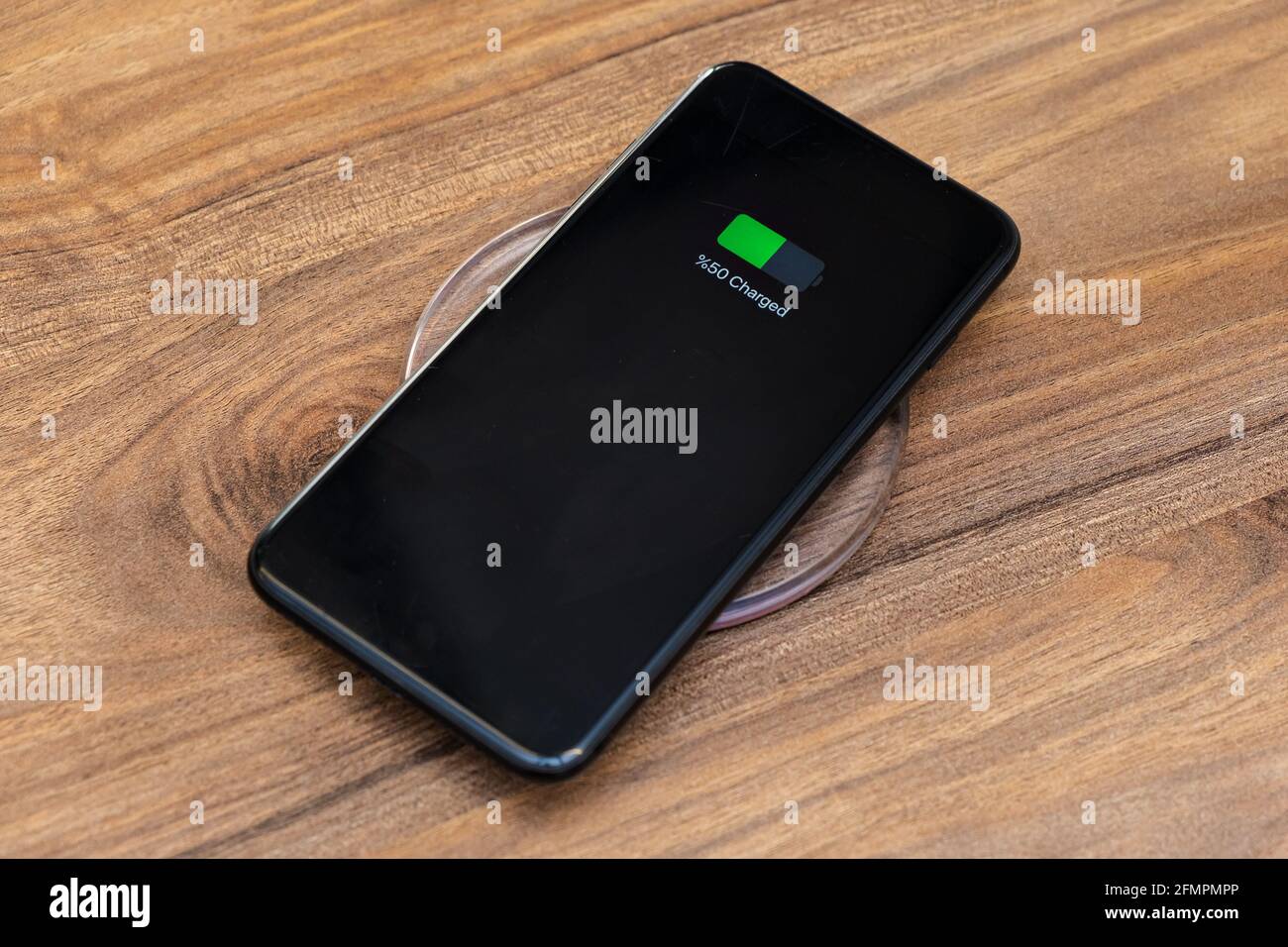 smartphone battery charging showing half charged battery on fast