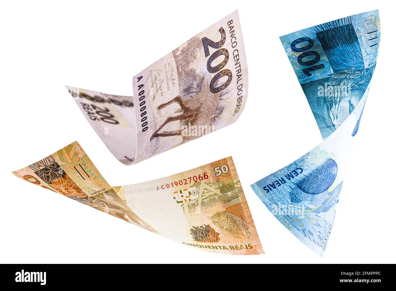 many banknotes from brazil falling on white background, two hundred ...