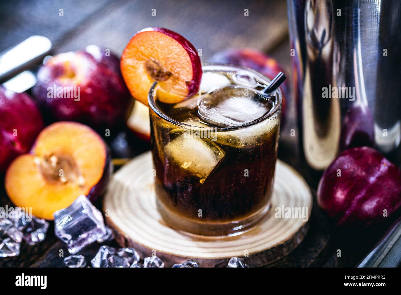 glass of typical Brazilian drink called caipirinha, plum, distilled