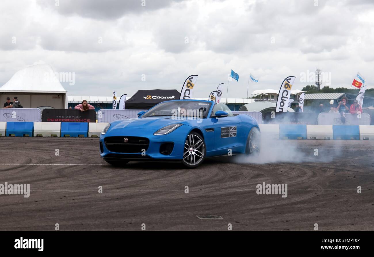 Drifting demonstration performed in a Jaguar F-Type S in the adrenaline zone of the Silverstone Classic 2017 Stock Photo