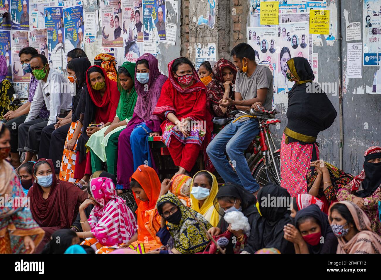 Dhaka, Bangladesh. 11th May, 2021. Garment workers of Binni Garments Ltd block the road at the factory demanding payment of due wages and Eid bonus. (Photo by Zabed Hasnain Chowdhury/SOPA Images/Sipa USA) Credit: Sipa USA/Alamy Live News Stock Photo
