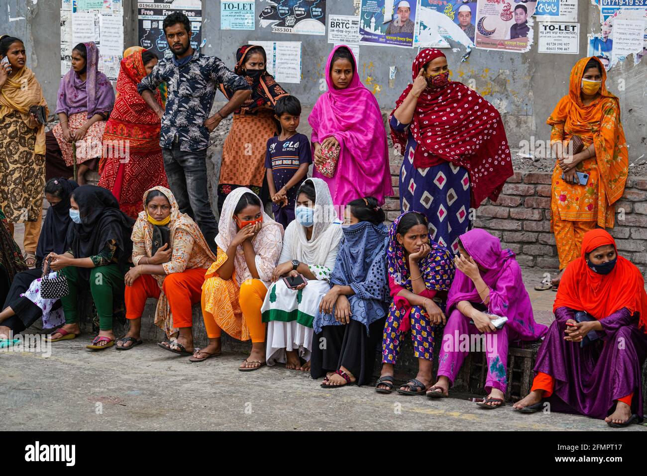 Dhaka, Bangladesh. 11th May, 2021. Garment workers of Binni Garments Ltd block the road at the factory demanding payment of due wages and Eid bonus. (Photo by Zabed Hasnain Chowdhury/SOPA Images/Sipa USA) Credit: Sipa USA/Alamy Live News Stock Photo