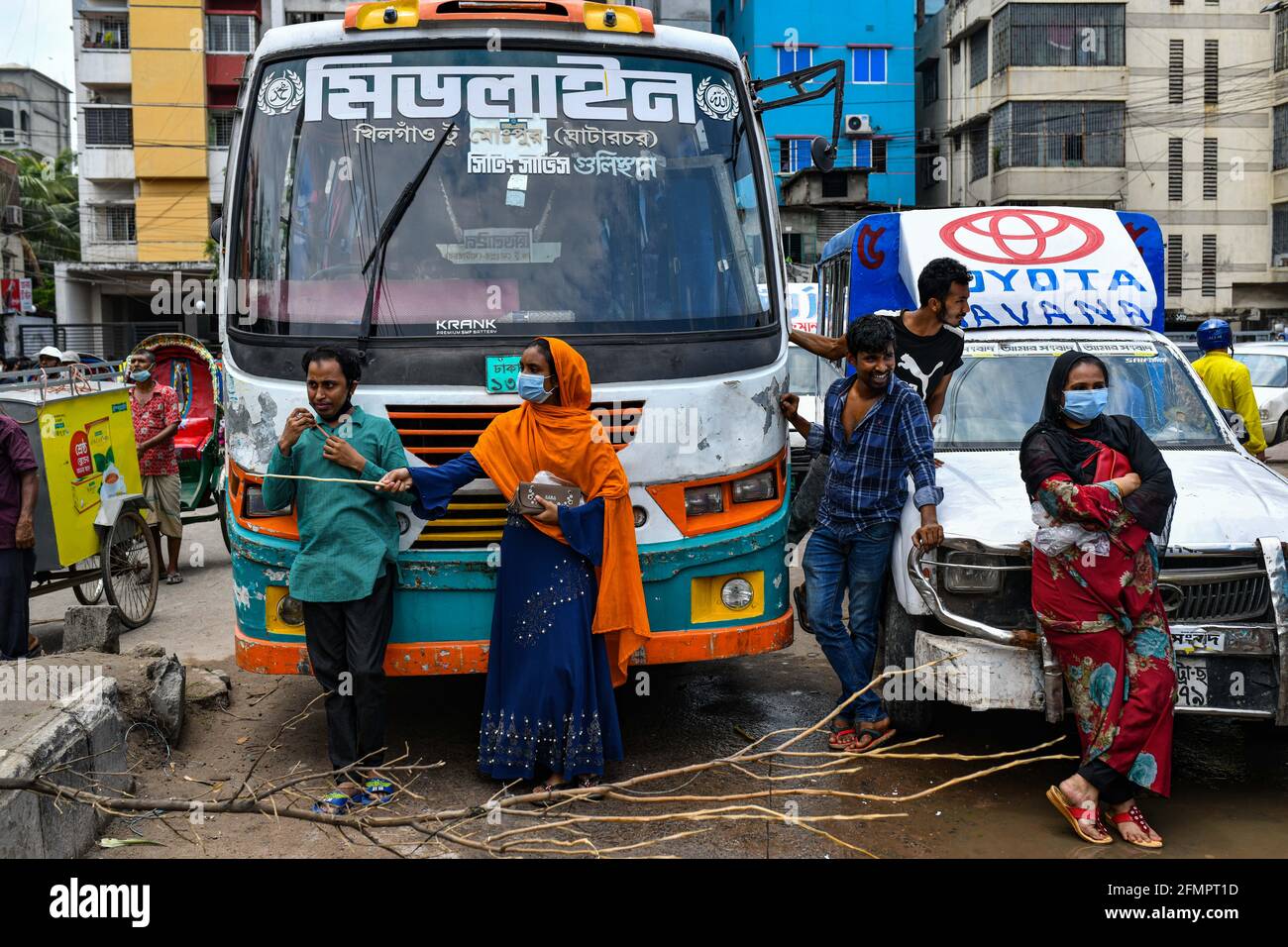 Dhaka, Bangladesh. 11th May, 2021. Garment workers of Binni Garments Ltd block the road at the factory demanding payment of due wages and Eid bonus. (Photo by Zabed Hasnain Chowdhury/SOPA Images/Sipa USA) Credit: Sipa USA/Alamy Live News Stock Photo