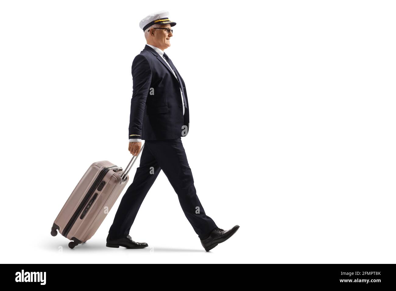 Full length profile shot of a pilot with a walking and pulling a