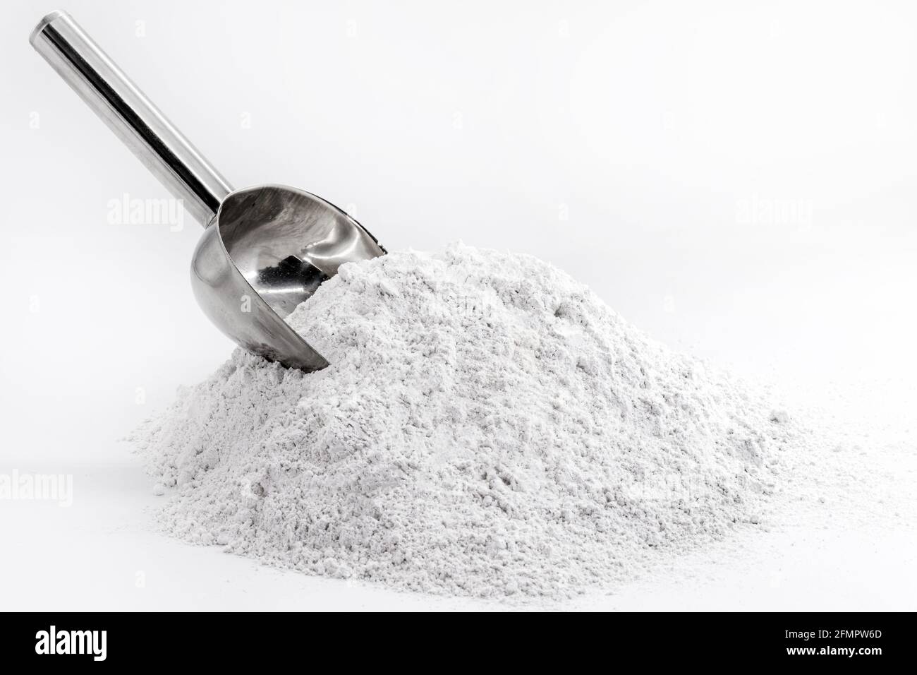 kaolin, on a weighing scale, kaolin is a mineral of inorganic constitution Stock Photo