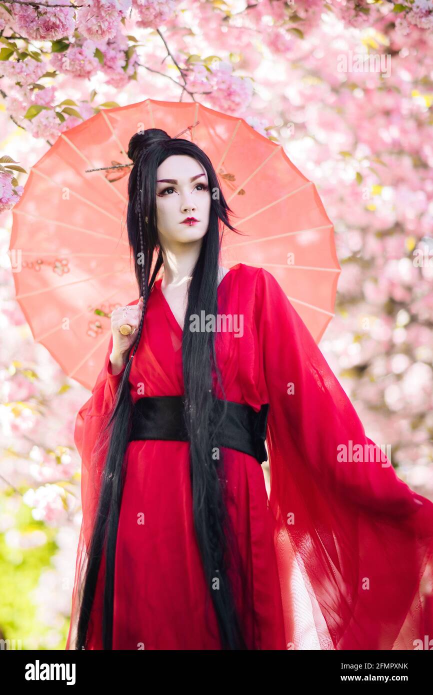 Japanese Geisha Walking Through a Cherry Blossom Forest Picture Framed Print