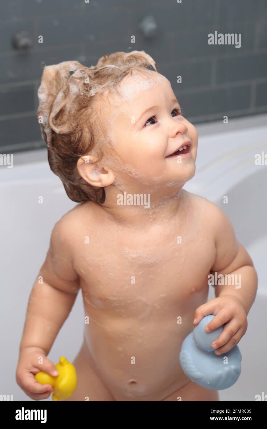 Cute funny baby boy enjoying bath and bathed in the bathroom Stock ...