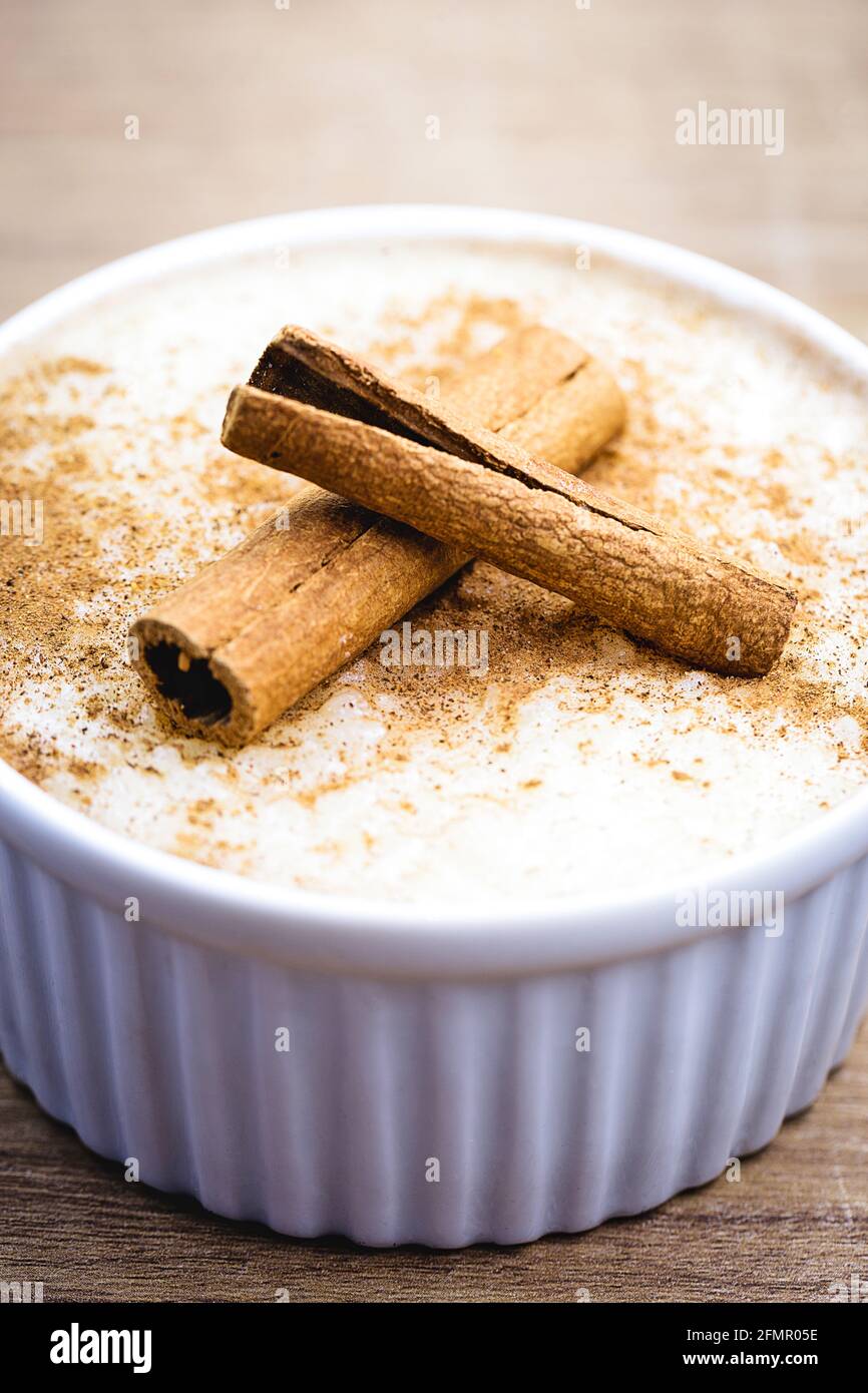 Creamy rice pudding sprinkled with cinnamon, typical Brazilian dessert ...