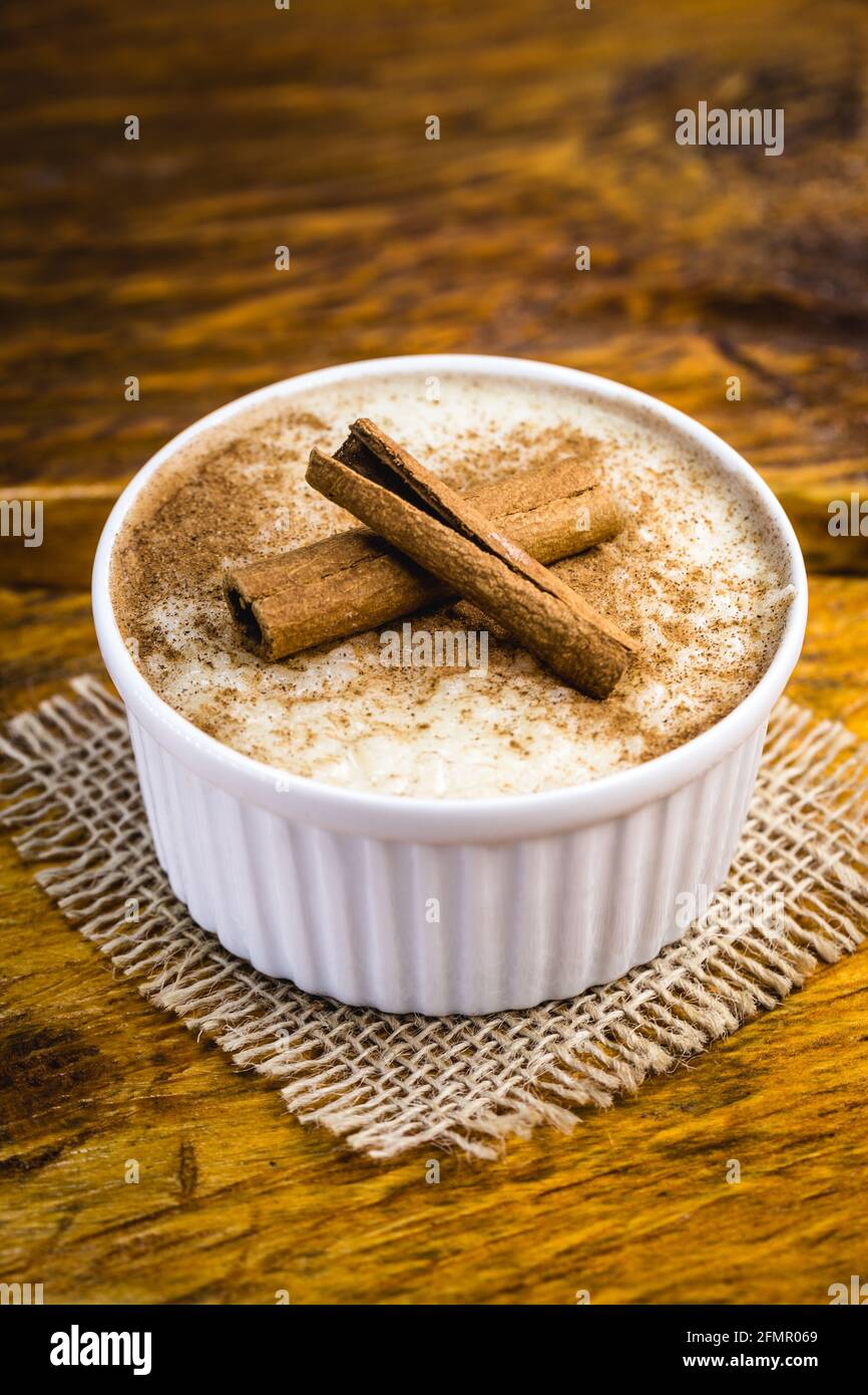 Creamy rice pudding sprinkled with cinnamon, typical Brazilian dessert ...