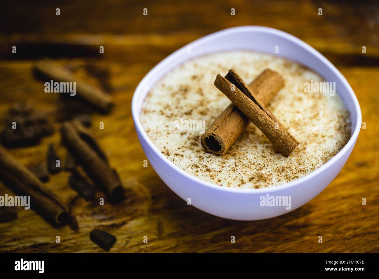 Creamy rice pudding sprinkled with cinnamon, typical Brazilian dessert ...