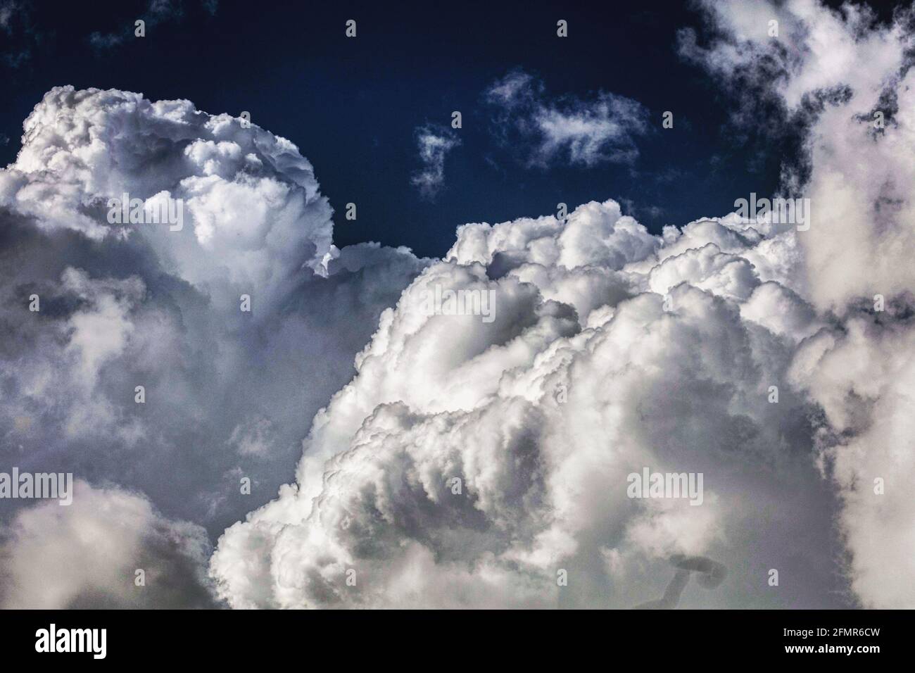 Cumulonimbus Clouds gathering before the storm Stock Photo