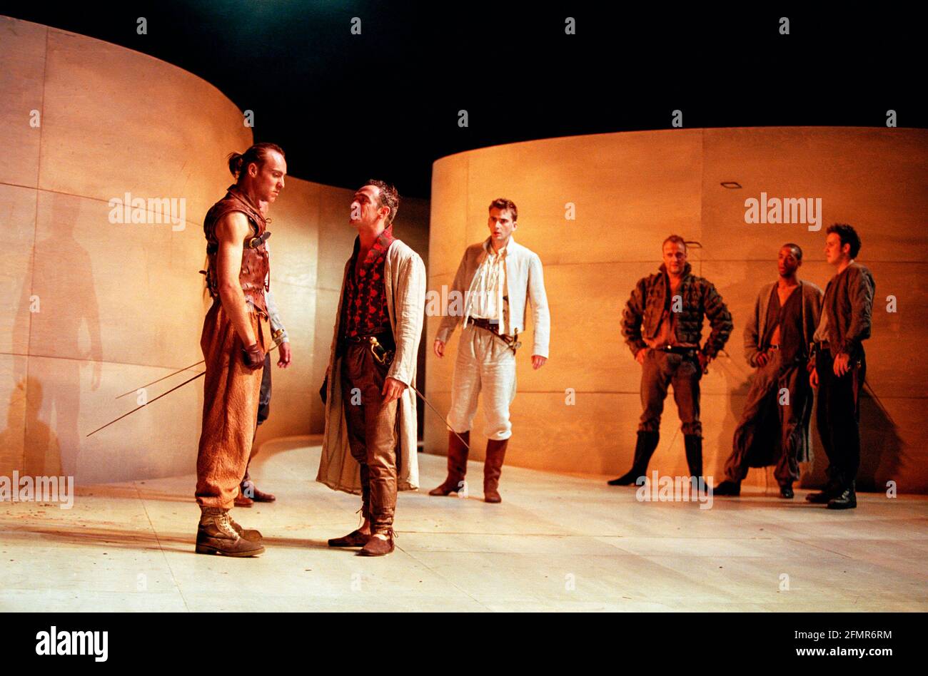 front, l-r: Keith Dunphy (Tybalt), Adrian Schiller (Mercutio), David Tennant (Romeo) in ROMEO AND JULIET by Shakespeare at the Royal Shakespeare Company (RSC), Royal Shakespeare Theatre, Stratford-upon-Avon  05/07/2000  music: Stephen Warbeck  design: Tom Piper  lighting: Chris Davey  fights: Terry King  movement: Liz Ranken  director: Michael Boyd Stock Photo