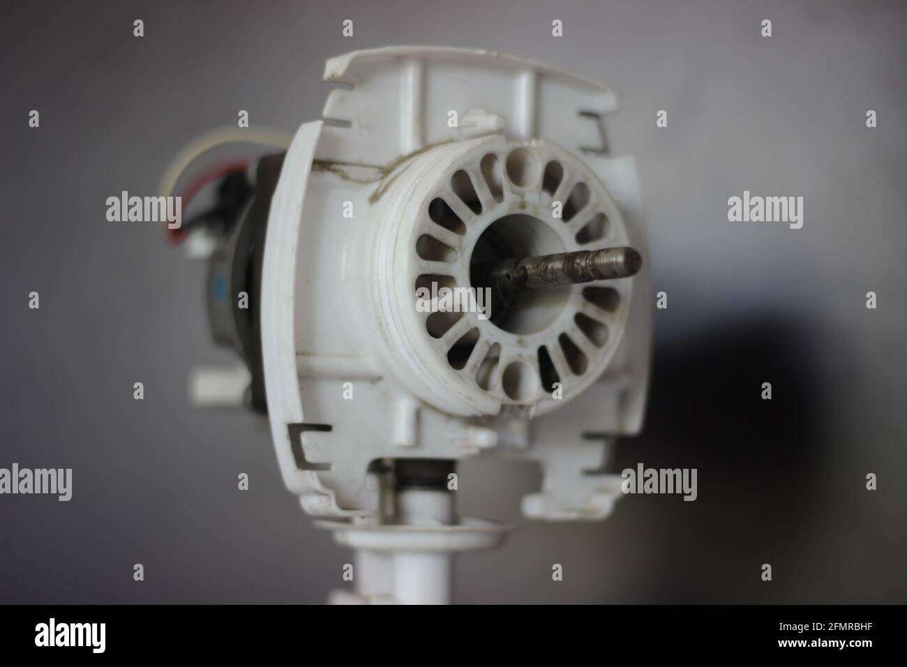 Mumbai, Maharashtra, India, March 07 2021: Opened up motor of a pedestal fan with details of the rotating mechanism. Stock Photo