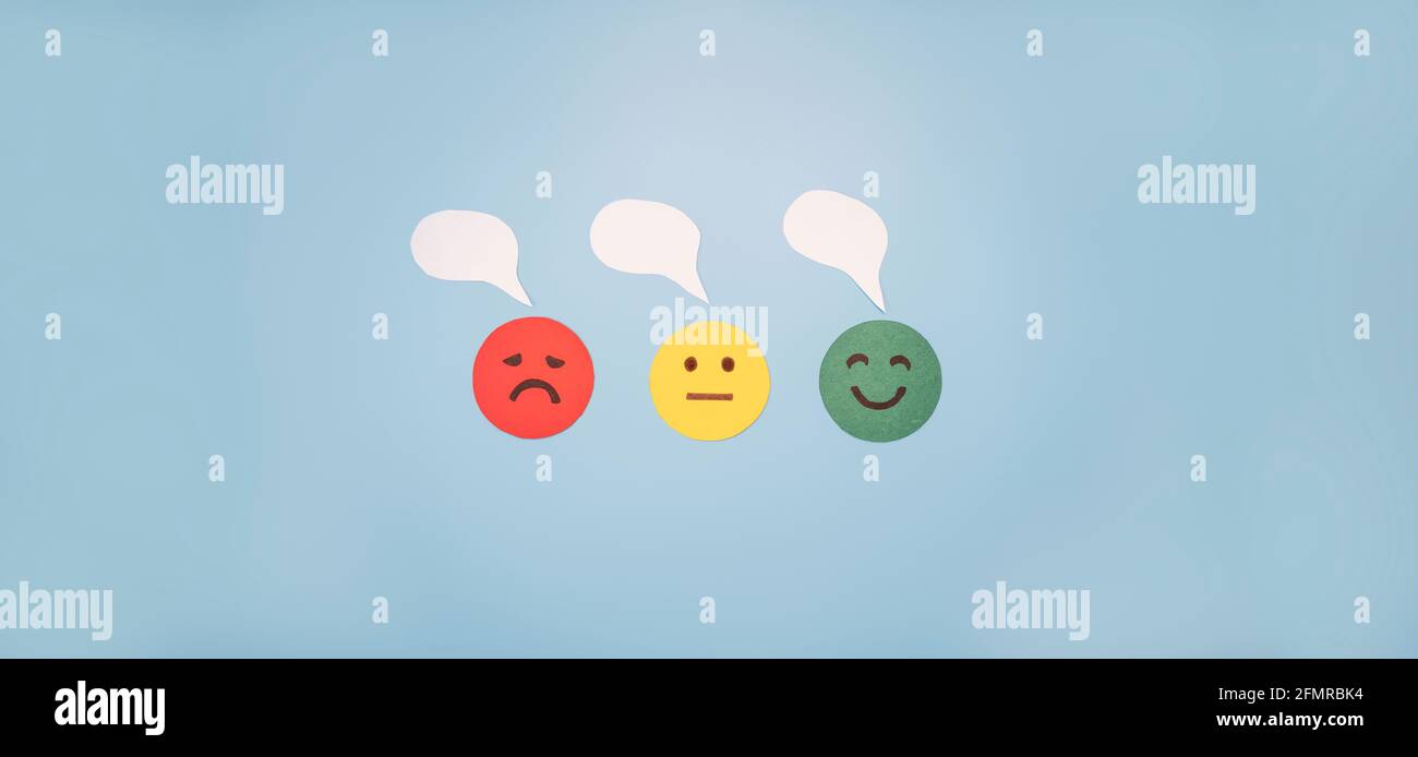 Emotions: positive, neutral and negative (red, yellow and green different moods). Rating smile for customer opinion. Paper cut. Stock Photo