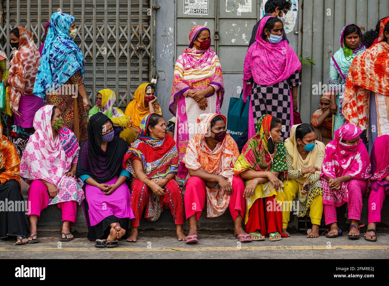 Dhaka, Bangladesh. 11th May, 2021. Garment workers of Binni Garments Ltd block the road at the factory demanding payment of due wages and Eid bonus. Credit: SOPA Images Limited/Alamy Live News Stock Photo