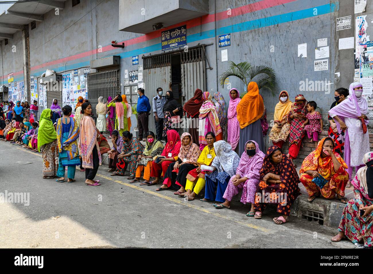 Dhaka, Bangladesh. 11th May, 2021. Garment workers of Binni Garments Ltd block the road at the factory demanding payment of due wages and Eid bonus. Credit: SOPA Images Limited/Alamy Live News Stock Photo