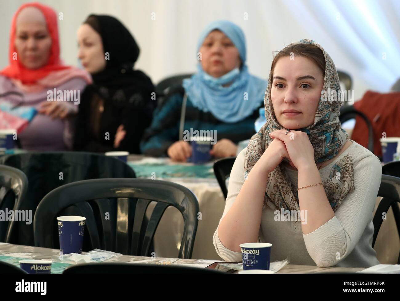 Moscow, Russia. 11th May, 2021. Muslim women prepare to perform a prayer  [namaz] at the annual Ramadan Tent event on the Poklonnaya Hill. During the  Islamic month of Ramadan, a tent is