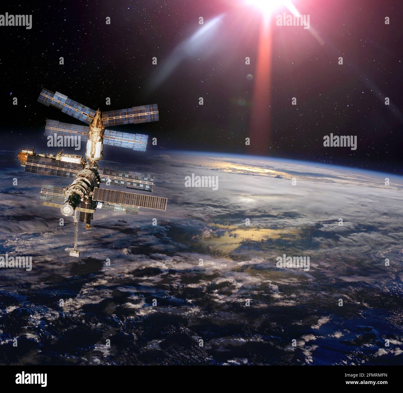 Space station under cloudy earth in space. Elements of this image furnished by NASA. Stock Photo