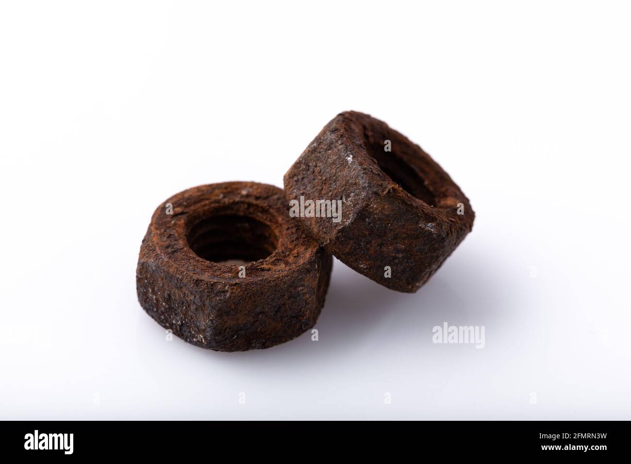 old rusty aged bolt, not usable, rusty item on white background  Stock Photo