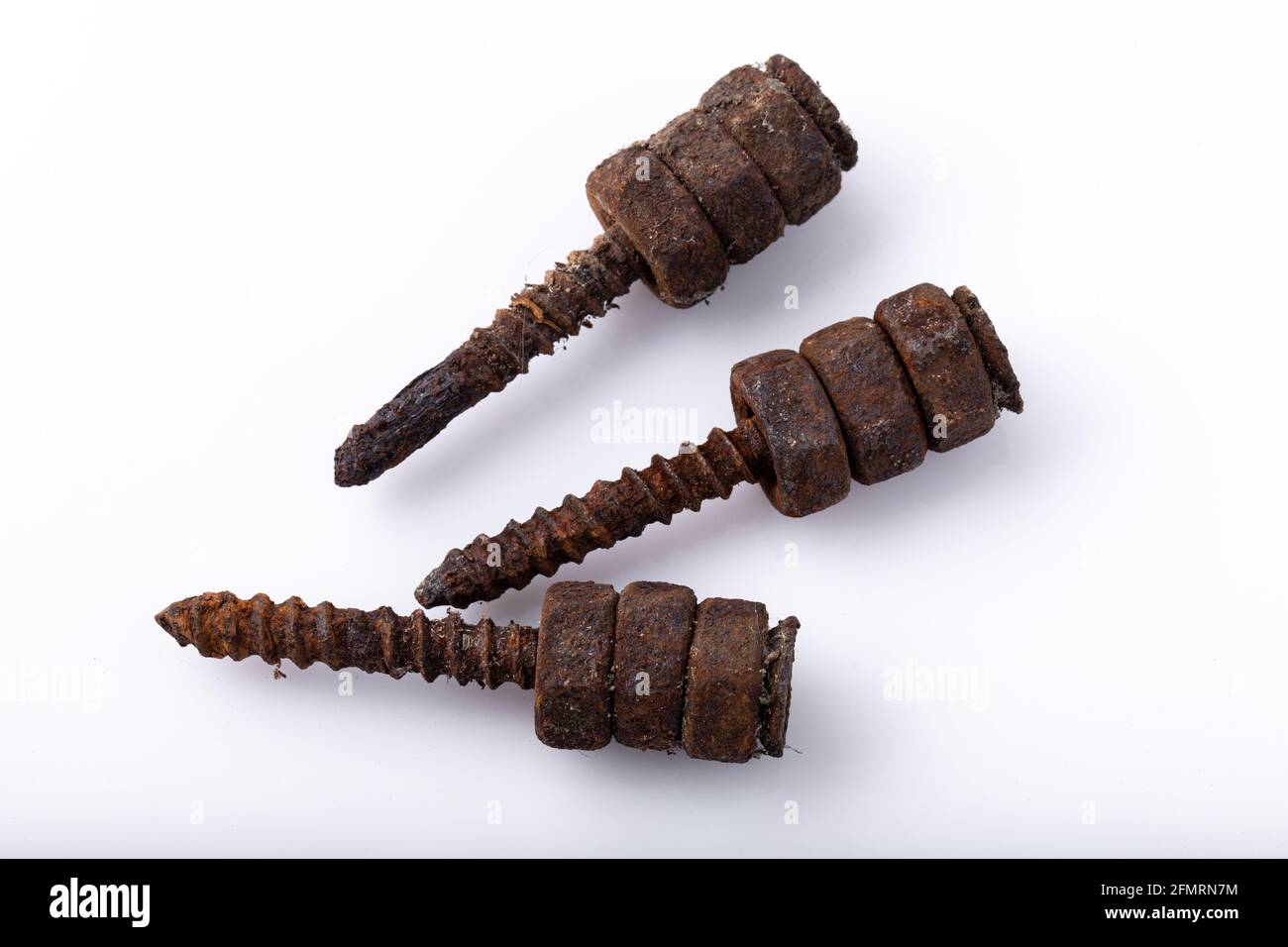 old rusty aged bolt, not usable, rusty item on white background  Stock Photo