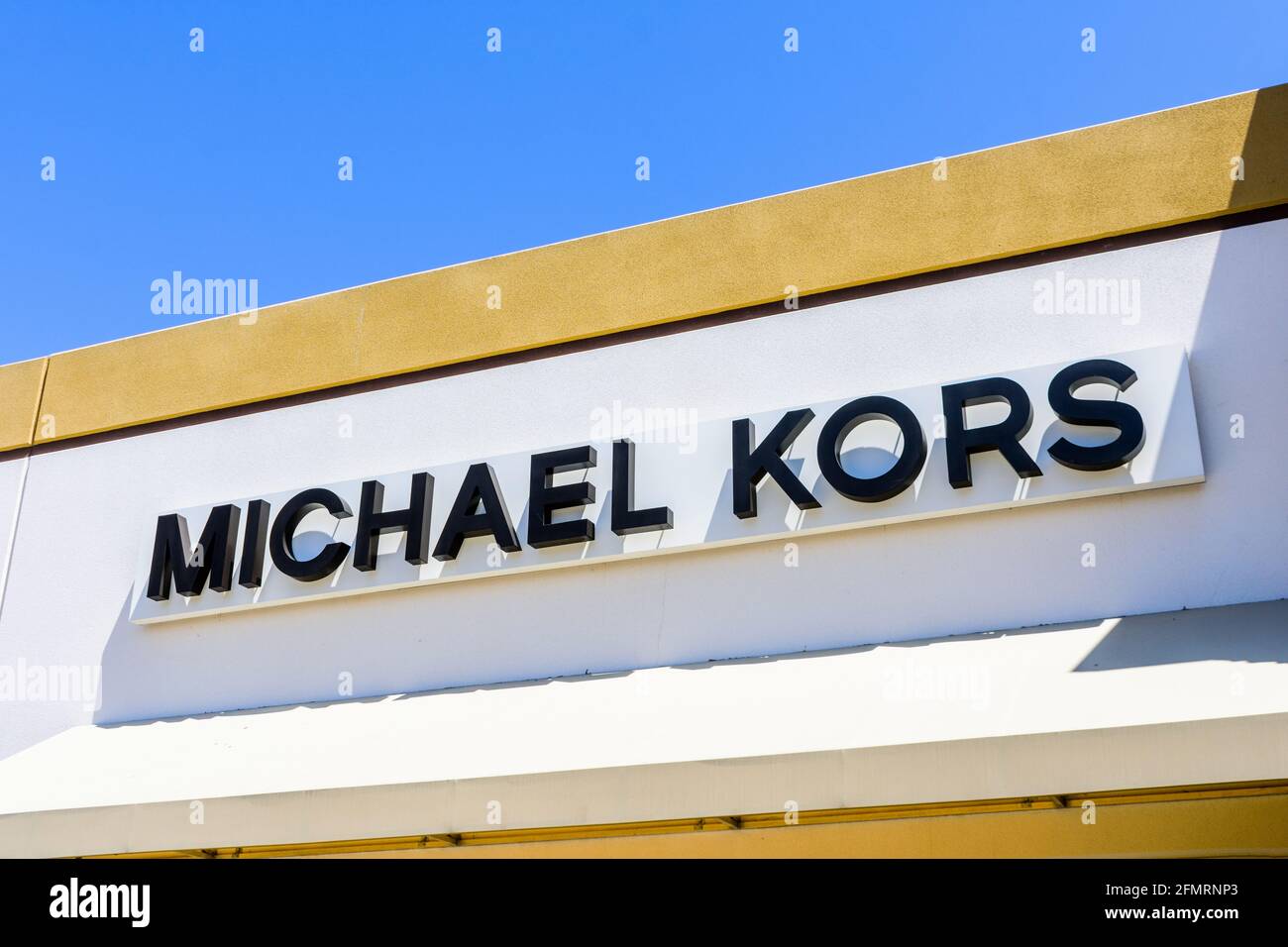 Michael Kors store sign above the entrance to retail chain store - Los Angeles, California, USA - 2021 Stock Photo