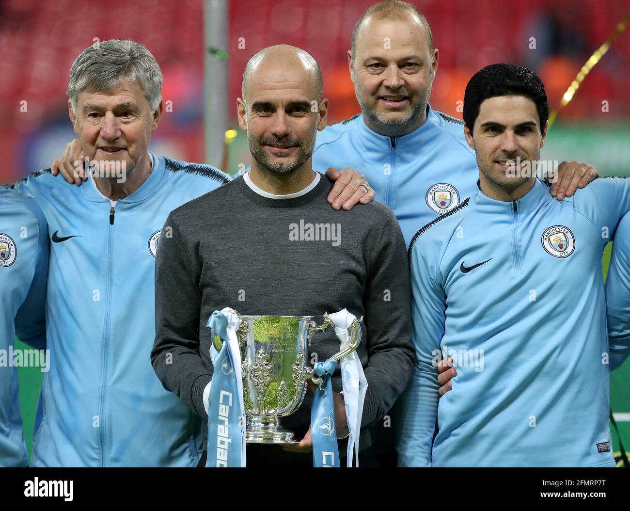 File photo dated 24-02-2019 of Manchester City manager Pep Guardiola with his backroom staff pose with the trophy after the Carabao Cup Final. Issue date: Tuesday May 11, 2021. Stock Photo