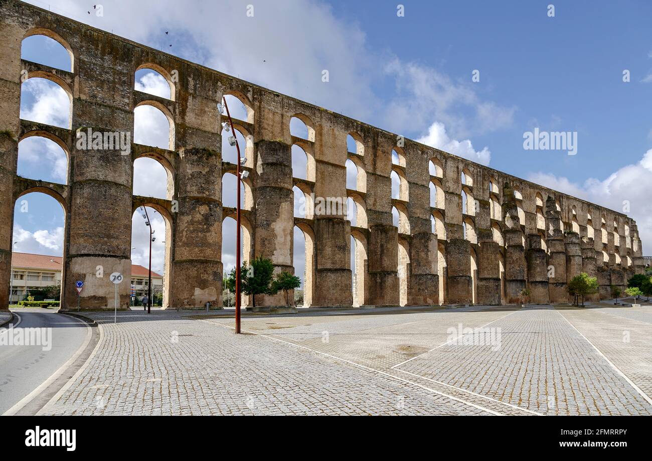 The Arches Of The Roman Aqueduct Aqueduto Da Amoreira In Elvas In the-arches-of-the-roman-aqueduct-aqueduto-da-amoreira-in-elvas-in