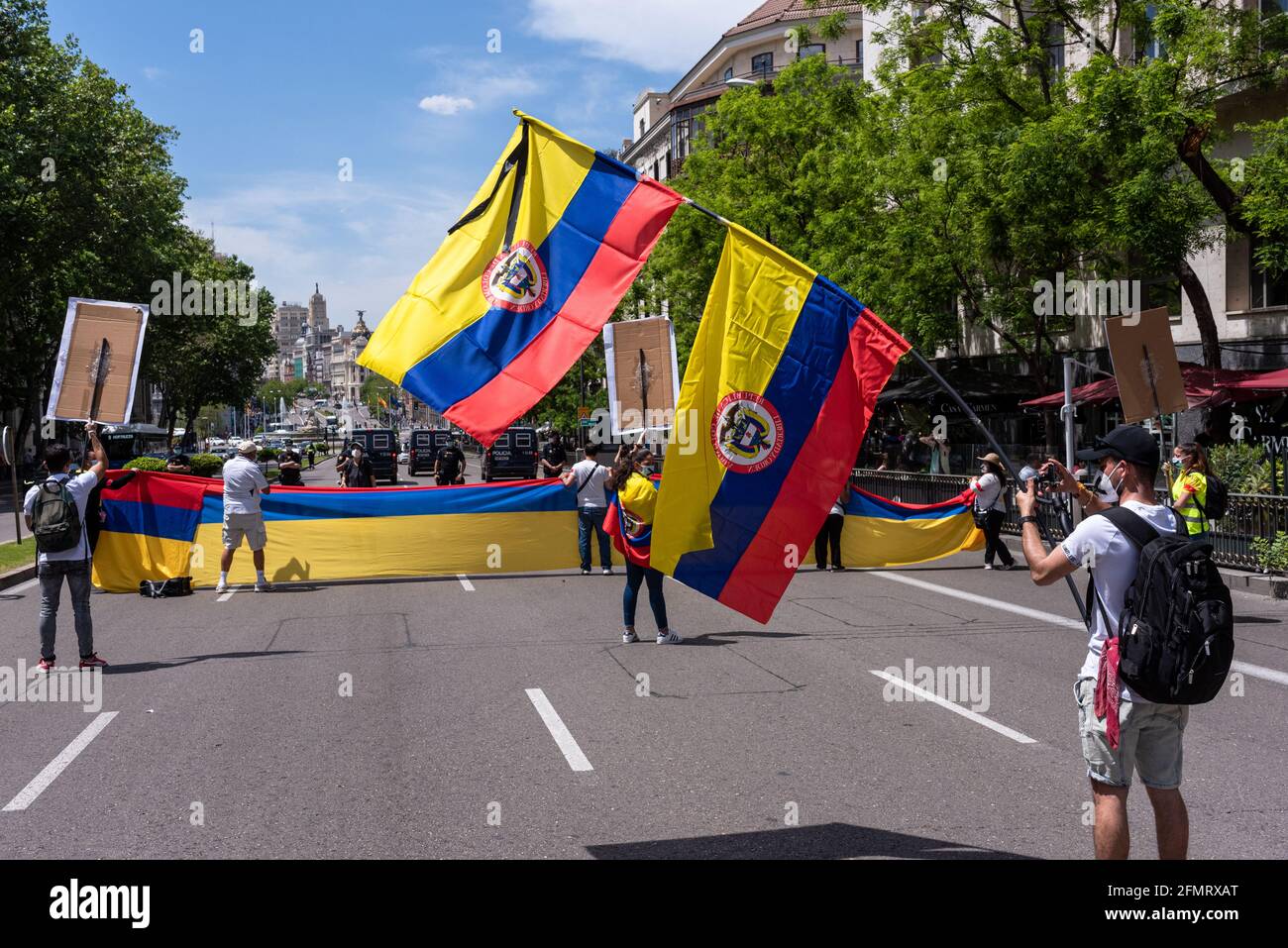 Madrid, Spain, 8th may 2021. Protesters attend a demonstration in support of Colombian citizens fighting violent repression of anti-government protest Stock Photo