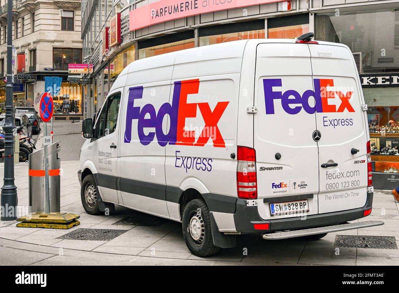 Vienna, Austria - November 2019: Fed Ex delivery van parked on a street while delivering stock to shops in Vienna city centre Stock Photo