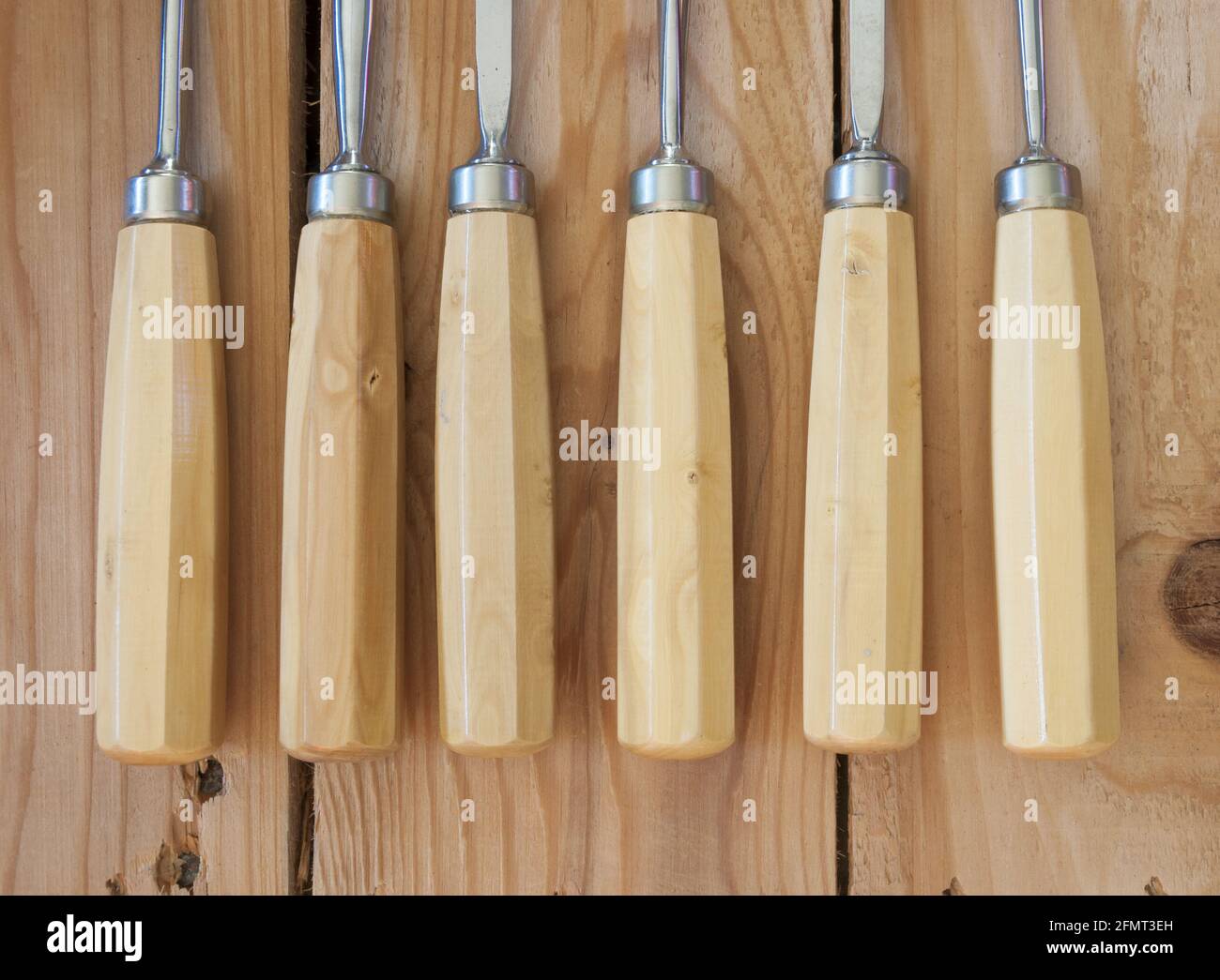 Top view of wooden handles of several gouges Stock Photo - Alamy