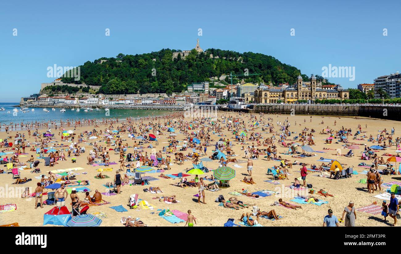 San Sebastian, Spain - August 22, 2016: Watches on the beach promenade of La Concha in San Sebastian in a sunny day on August Stock Photo