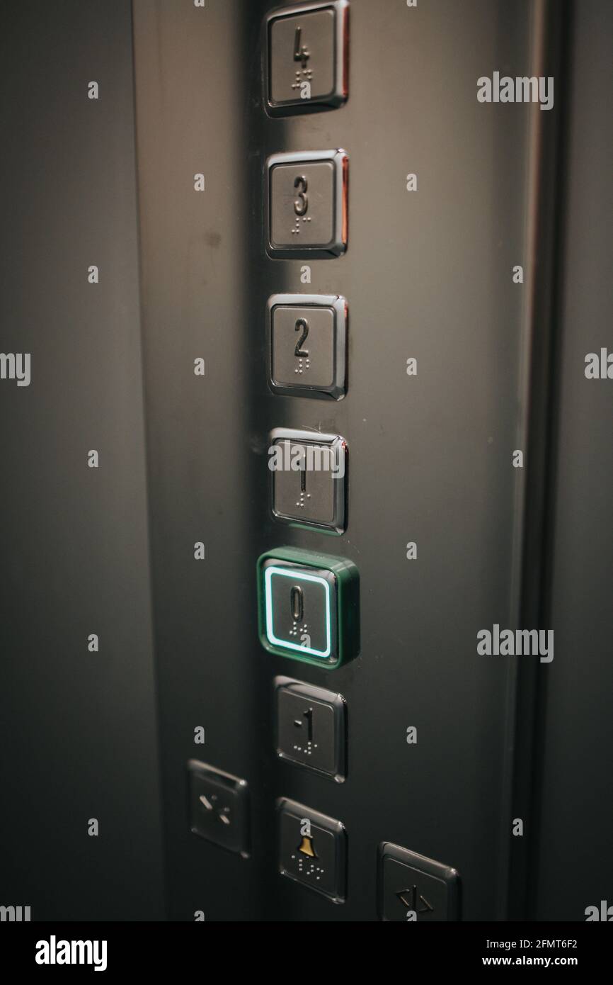 Vertical shot of elevator buttons with the lowest floor button pressed ...