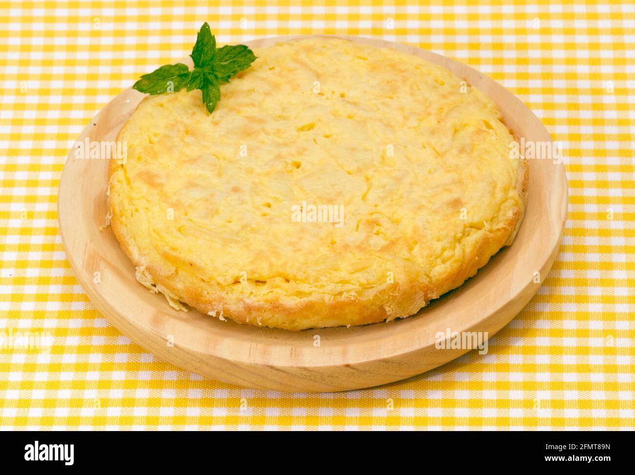 Spanish omelette with potatoes, parsley leaf gift auction Stock Photo