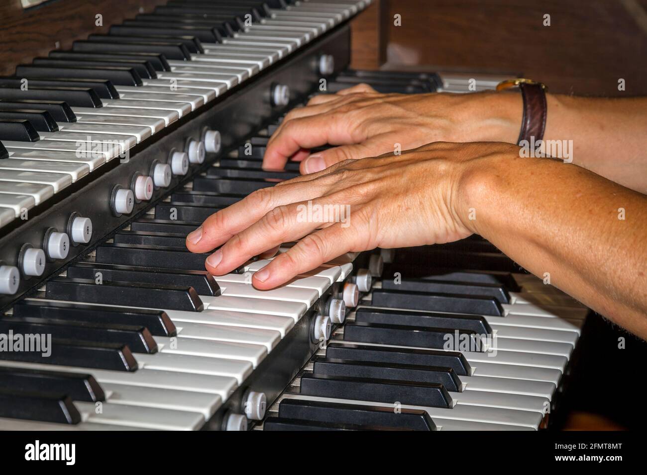 hands playing organ Stock Photo