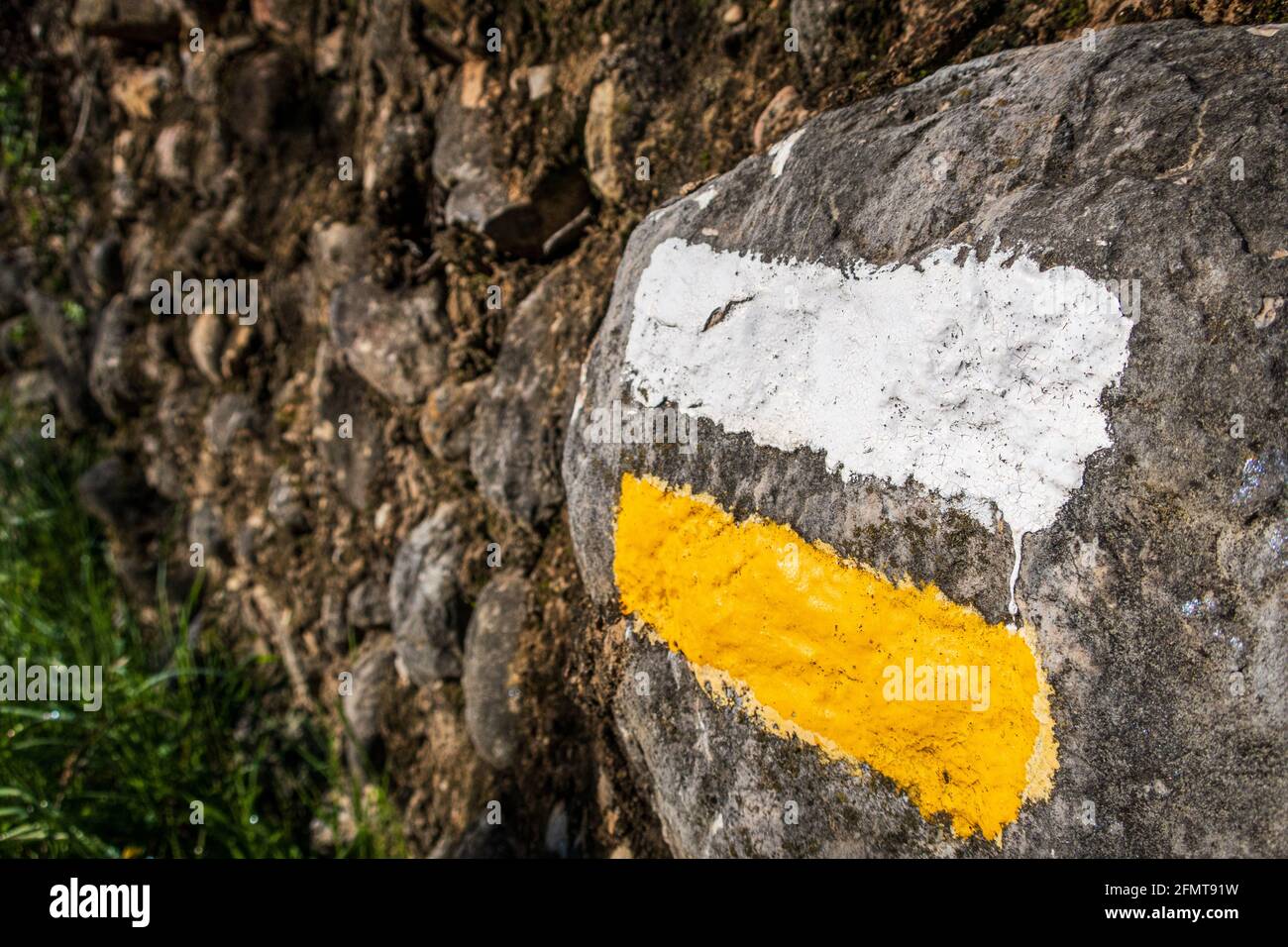 White Rocks Marking Closeup of white and yellow indication marks for hikers on a rock under ...