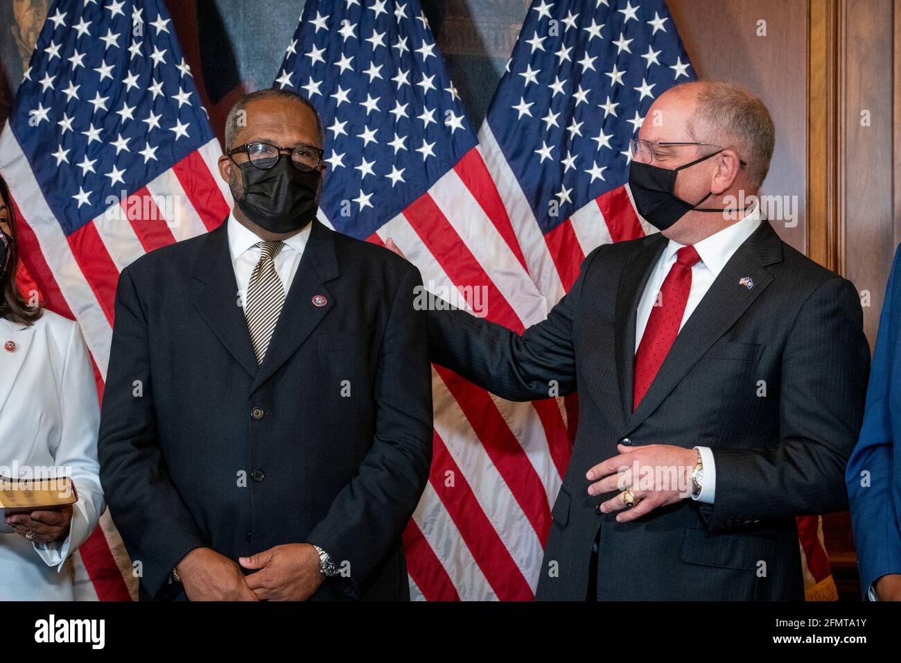 Washington, United States Of America. 11th May, 2021. United States Representative Troy Carter (Democrat of Louisiana), left, is joined by Louisiana Gov. John Bel Edwards, right, during his ceremonial swearing-in by Speaker of the United States House of Representatives Nancy Pelosi (Democrat of California) at the US Capitol in Washington, DC, Tuesday, May 11, 2021. Credit: Rod Lamkey/CNP | usage worldwide Credit: dpa/Alamy Live News Stock Photo