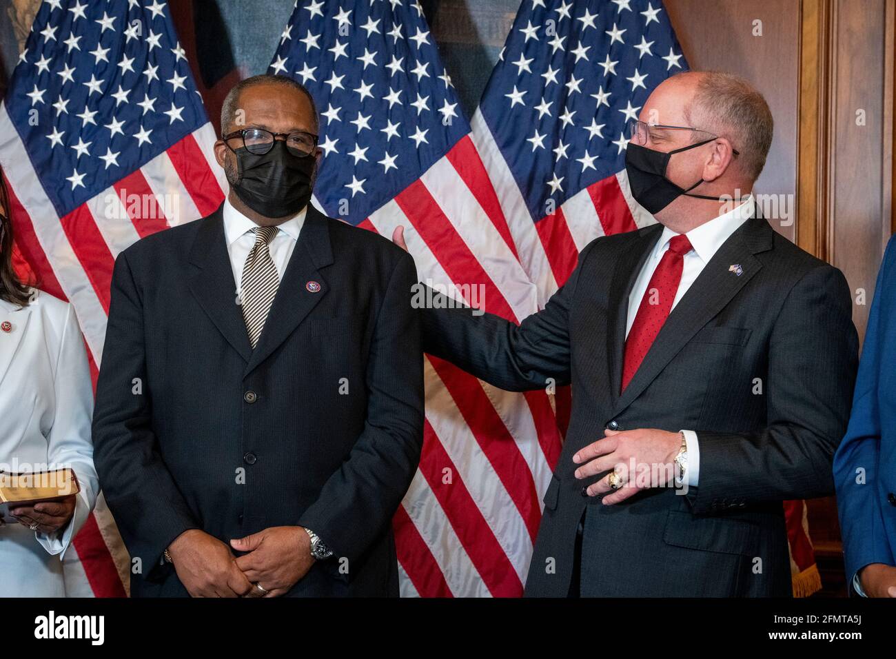 Washington, United States Of America. 11th May, 2021. United States Representative Troy Carter (Democrat of Louisiana), left, is joined by Louisiana Gov. John Bel Edwards, right, during his ceremonial swearing-in by Speaker of the United States House of Representatives Nancy Pelosi (Democrat of California) at the US Capitol in Washington, DC, Tuesday, May 11, 2021. Credit: Rod Lamkey/CNP | usage worldwide Credit: dpa/Alamy Live News Stock Photo