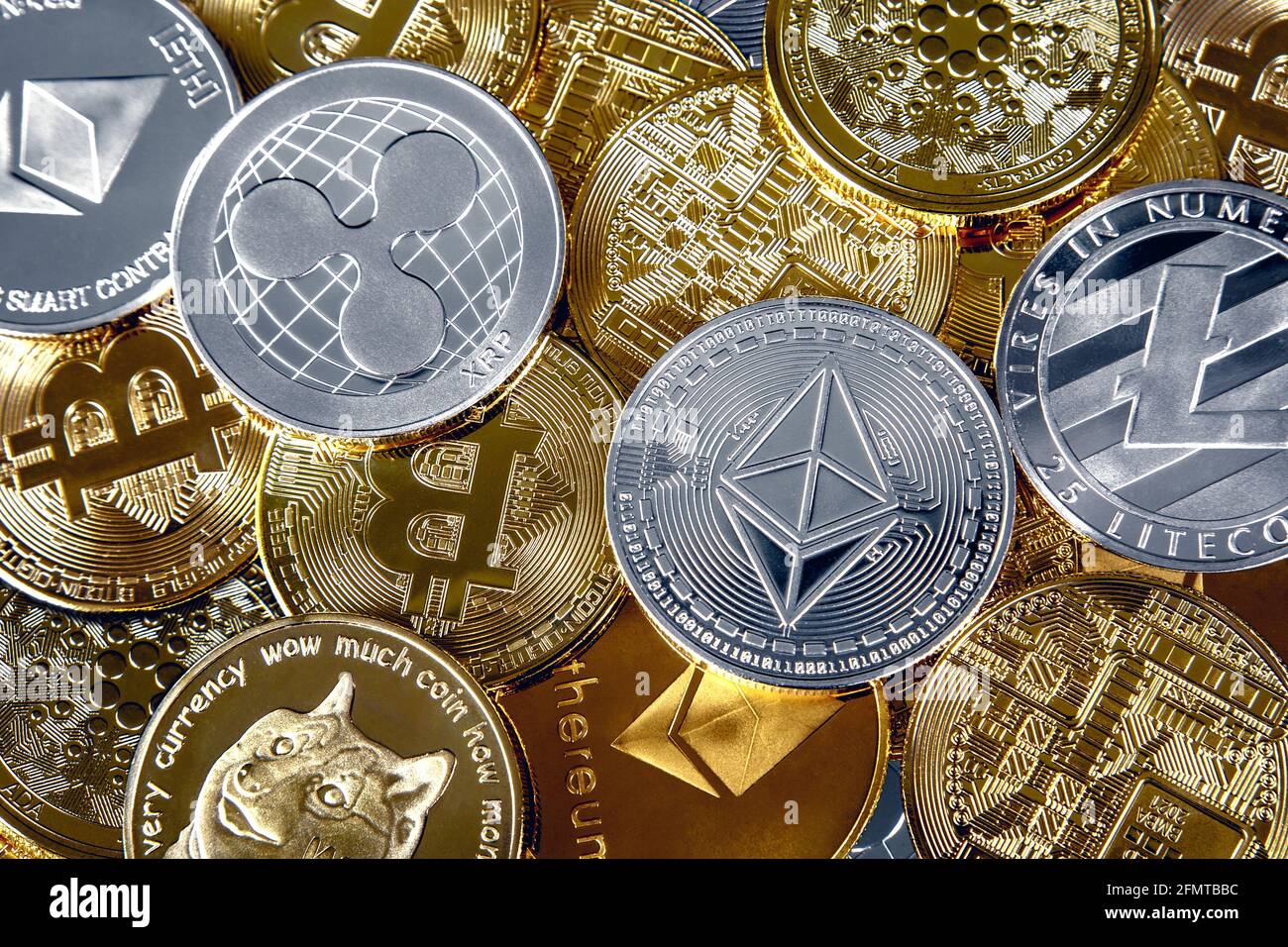 Selection of cryptocurrency token coins including ethereum, ripple,  dogecoin, bitcoin, cardano and litecoin background Stock Photo - Alamy