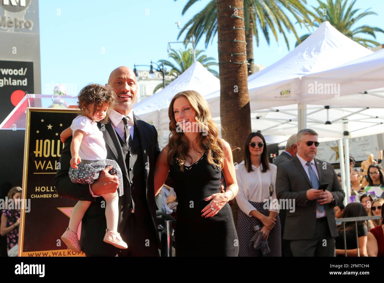 LOS ANGELES - DEC 13:  Dwayne Johnson, Jasmine Johnson, Lauren Hashian at the Dwayne Johnson Star Ceremony on the Hollywood Walk of Fame on December 13, 2017 in Los Angeles, CA Stock Photo